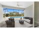 Inviting lanai with comfortable seating overlooking a sparkling pool and lush landscaping at 16271 Branco Dr, Punta Gorda, FL 33955