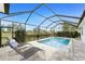 Screened in pool area with lounge chairs for outdoor relaxation at 16271 Branco Dr, Punta Gorda, FL 33955