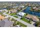 Stunning aerial view of upscale waterfront homes featuring private docks and well-maintained landscaping along a canal at 1631 Casey Key Dr, Punta Gorda, FL 33950