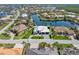An aerial view showcases the home's prime location on a canal with mature landscaping at 1631 Casey Key Dr, Punta Gorda, FL 33950
