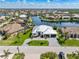 Stunning aerial view of a waterfront home showcasing lush landscaping and beautiful curb appeal at 1631 Casey Key Dr, Punta Gorda, FL 33950