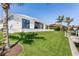 A beautifully manicured backyard and green lawn are adjacent to the water, with plenty of room to play at 1631 Casey Key Dr, Punta Gorda, FL 33950