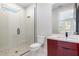 Contemporary bathroom showcasing a walk-in shower, modern vanity, and stylish tile flooring at 1631 Casey Key Dr, Punta Gorda, FL 33950