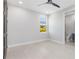Well-lit bedroom with a side view window and modern finishes at 1631 Casey Key Dr, Punta Gorda, FL 33950