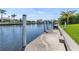 Concrete dock on a calm canal, perfect for boating and enjoying waterfront living at 1631 Casey Key Dr, Punta Gorda, FL 33950