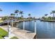 Waterfront dock with boat and power hookups offering convenient access to the canal and surrounding waterways at 1631 Casey Key Dr, Punta Gorda, FL 33950