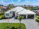 Stunning single-Gathering home featuring a metal roof, impact windows and doors, and a spacious three-car garage at 1631 Casey Key Dr, Punta Gorda, FL 33950
