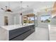 Bright, modern kitchen with a large island, stylish lighting and an indoor-outdoor flow at 1631 Casey Key Dr, Punta Gorda, FL 33950