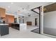 Spacious open kitchen featuring a sleek island, modern appliances, and seamless indoor-outdoor access at 1631 Casey Key Dr, Punta Gorda, FL 33950