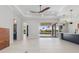 Open concept living room with sleek flooring, recessed lighting, and seamless flow to the outdoor area at 1631 Casey Key Dr, Punta Gorda, FL 33950