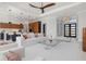 Open-concept living room with stylish decor, gourmet kitchen, and an elegant entryway at 1631 Casey Key Dr, Punta Gorda, FL 33950