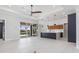 Open floor plan with living space featuring tile flooring, modern fixtures, and water views at 1631 Casey Key Dr, Punta Gorda, FL 33950