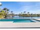 Inviting private pool and patio overlooking the waterfront with boat dock, great for outdoor relaxation at 1631 Casey Key Dr, Punta Gorda, FL 33950