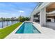 Inviting private pool and patio overlooking the waterfront, perfect for outdoor relaxation and entertaining at 1631 Casey Key Dr, Punta Gorda, FL 33950