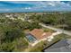 Aerial view of the screen enclosed pool and rear yard of the home at 16571 Cape Horn Blvd, Punta Gorda, FL 33955