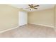 Bedroom featuring neutral colored walls, tile floor, closet and ceiling fan at 16571 Cape Horn Blvd, Punta Gorda, FL 33955