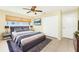 Well-furnished bedroom featuring a large bed, stylish decor, and ample natural light at 16571 Cape Horn Blvd, Punta Gorda, FL 33955