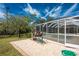 Pool equipment is positioned outside of the screen enclosed patio and landscaping at 16571 Cape Horn Blvd, Punta Gorda, FL 33955