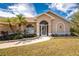 Charming home featuring a well-manicured lawn and attractive landscaping at 16571 Cape Horn Blvd, Punta Gorda, FL 33955