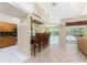 Open kitchen with breakfast bar, tile floors, and modern appliances, looking to lanai at 16571 Cape Horn Blvd, Punta Gorda, FL 33955