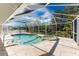 An inviting pool and hot tub are enclosed in a screened-in lanai at 16571 Cape Horn Blvd, Punta Gorda, FL 33955