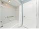 Tub and shower combination with white tile and safety bar at 16571 Cape Horn Blvd, Punta Gorda, FL 33955
