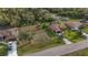 Aerial view of the house and property, showcasing the spacious yard and surrounding neighborhood at 17327 Wintergarden Ave, Port Charlotte, FL 33948