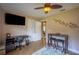 Comfortable bedroom showcasing desk, dual-door closet, and warm lighting for a relaxing ambiance at 17327 Wintergarden Ave, Port Charlotte, FL 33948