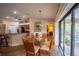 Bright dining room with glass table, comfortable seating, and sliding glass doors to patio at 17327 Wintergarden Ave, Port Charlotte, FL 33948