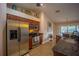Stylish kitchen showcasing stainless steel refrigerator, wooden cabinets, and granite countertops at 17327 Wintergarden Ave, Port Charlotte, FL 33948
