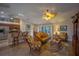 Open-concept living area with tile floors, ceiling fan, and views into the dining and kitchen spaces at 17327 Wintergarden Ave, Port Charlotte, FL 33948