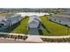 Aerial view of the home showcasing its well-maintained landscaping and proximity to a scenic lake at 17954 Saddle Rd, Punta Gorda, FL 33982