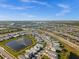 Aerial view of the community featuring well-maintained homes, picturesque lakes, and lush green spaces at 17954 Saddle Rd, Punta Gorda, FL 33982