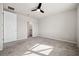 Bedroom with neutral carpet and a door to the ensuite bathroom and large closet at 17954 Saddle Rd, Punta Gorda, FL 33982