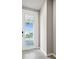 Front door featuring glass inserts and tile flooring, offering a welcoming entrance at 17954 Saddle Rd, Punta Gorda, FL 33982