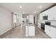 Open kitchen with a center island, stainless steel appliances, and a view into the connected living area at 17954 Saddle Rd, Punta Gorda, FL 33982