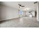 Open-concept living room with neutral walls, large windows, tile flooring, and recessed lighting at 17954 Saddle Rd, Punta Gorda, FL 33982
