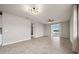 Bright and open living room with tile flooring, modern lighting fixtures, and a sliding door to the outside at 17954 Saddle Rd, Punta Gorda, FL 33982