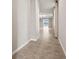 Bright living space featuring tile floors, ceiling fans, and sliding doors to the outdoors at 17954 Saddle Rd, Punta Gorda, FL 33982