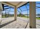 Spacious screened lanai overlooking a serene pond, perfect for outdoor relaxation at 17954 Saddle Rd, Punta Gorda, FL 33982