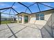 Covered, screened lanai with a view of the serene lake, offering a relaxing outdoor oasis at 17954 Saddle Rd, Punta Gorda, FL 33982