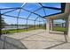 Screened lanai with beautiful views of the lake, providing an ideal outdoor space at 17954 Saddle Rd, Punta Gorda, FL 33982