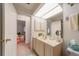 Bathroom with a skylight, vanity, and mirror at 18662 Arapahoe Cir, Port Charlotte, FL 33948