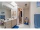 Bathroom with a skylight, vanity, and glass door shower at 18662 Arapahoe Cir, Port Charlotte, FL 33948