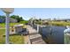 Private boat dock on the canal, equipped with a boat lift for easy water access at 18662 Arapahoe Cir, Port Charlotte, FL 33948