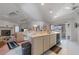 Bright, spacious kitchen with a large island, plenty of countertop space, and view of backyard at 18662 Arapahoe Cir, Port Charlotte, FL 33948