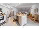 Open-concept kitchen with a large island and views of the living and dining areas at 18662 Arapahoe Cir, Port Charlotte, FL 33948
