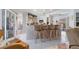 Kitchen with breakfast bar featuring seating for four, white cabinets, and access to the garage at 18662 Arapahoe Cir, Port Charlotte, FL 33948