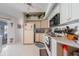 Bright kitchen with white cabinets, appliances, and ample counter space at 18662 Arapahoe Cir, Port Charlotte, FL 33948