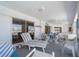 Spacious sunroom featuring comfortable lounge seating, dining table, and beautiful outdoor views at 18662 Arapahoe Cir, Port Charlotte, FL 33948